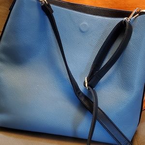 reversable Vegan Leather tote with cross body strap.